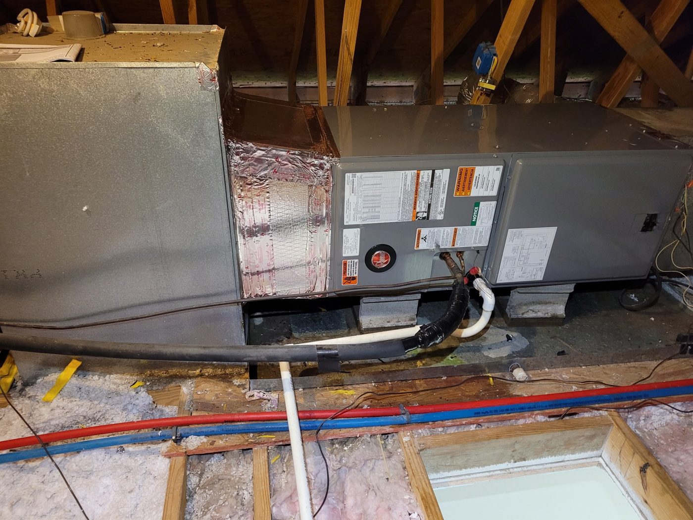Rheem air handler installed horizontally in an attic